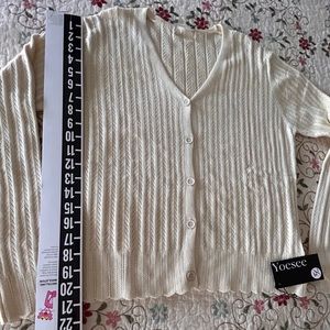 Yoder V-neck button down sweater. Labeled as XL my opinion, maybe a large.